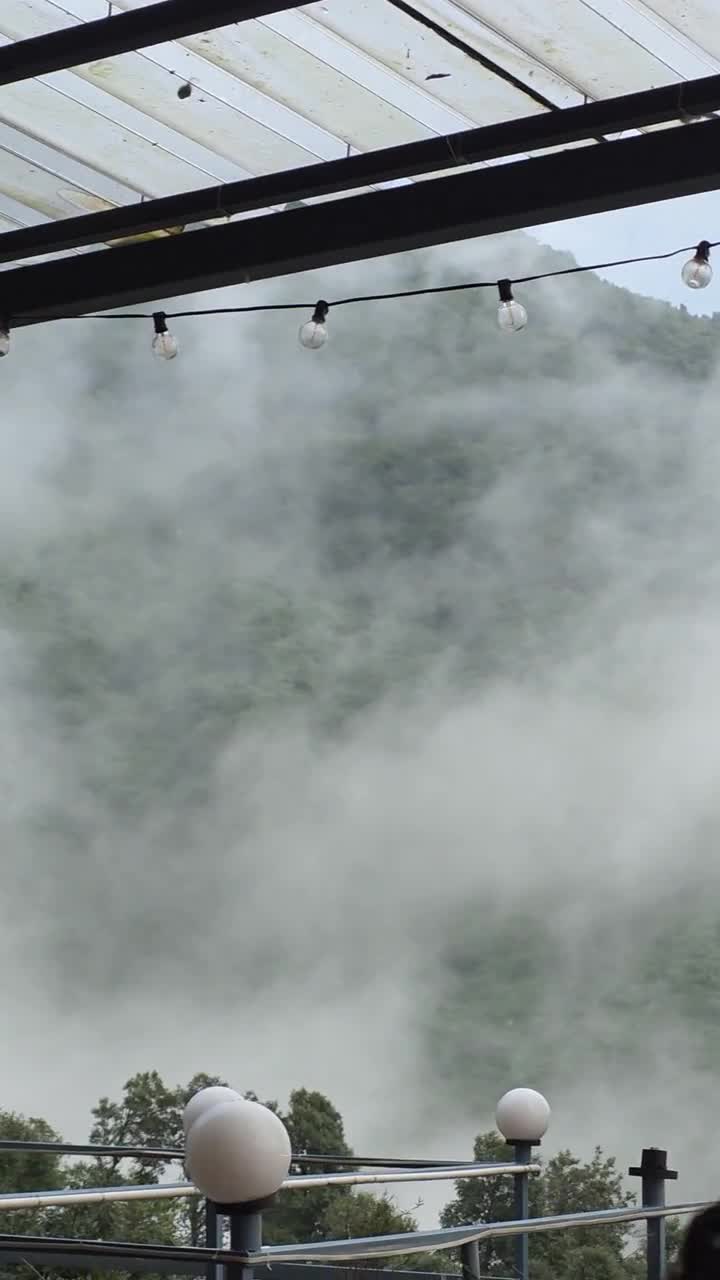 Clouds drifting over the forested hills in Kharota